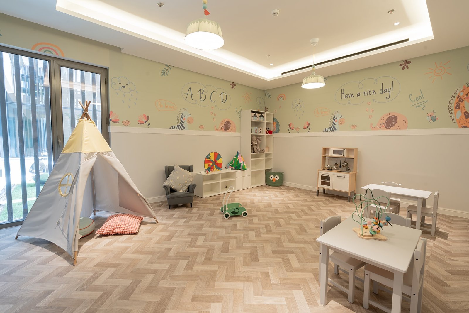 Bright and airy children's playroom with creative decor at Marissa Elite